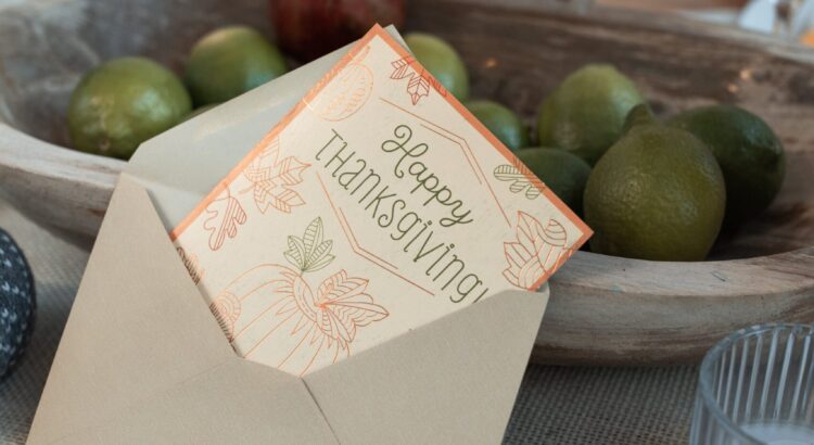 Image of a wrapped gift with a thank you card to illustrate a blog on the "Spirit of Giving"